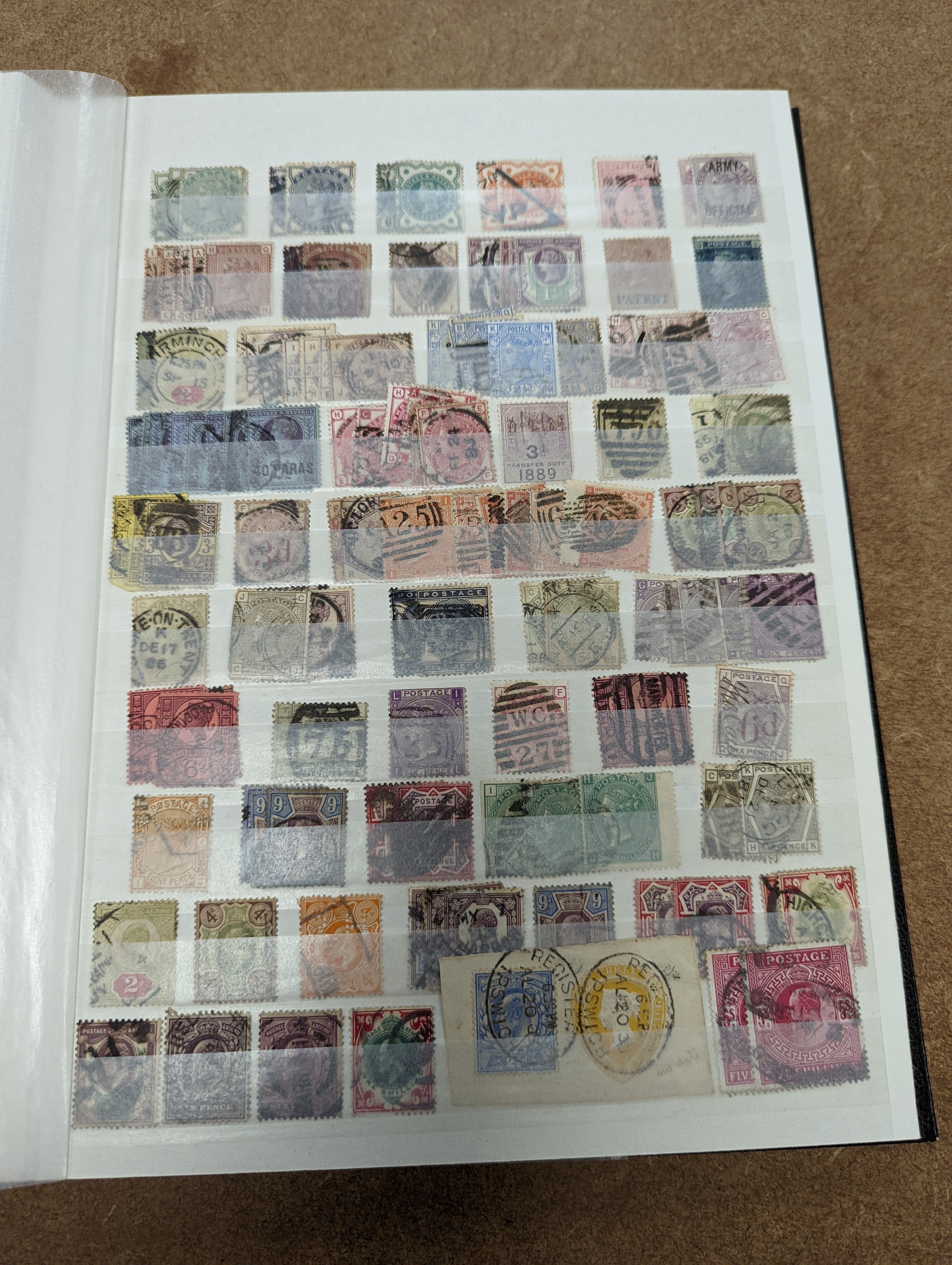 Great Britain stamps in stock book with 1840 1d black and 1841 2d blue unused. 1841 1d red brown mint block of 8, 1864-79 1d red plates in mint blocks including plate 79 block of 48, plate 170 block of 6 with marginal in